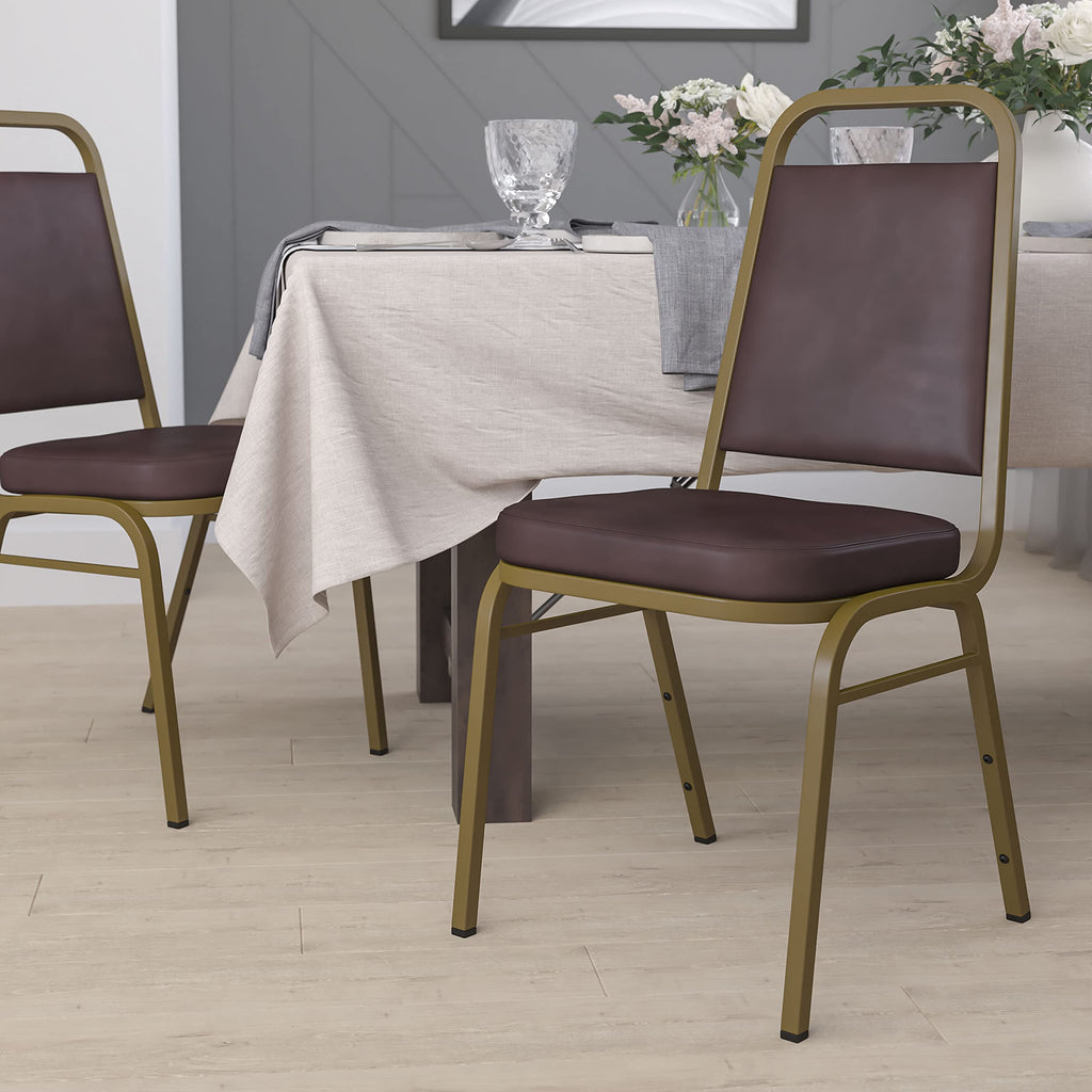 Emma + Oliver Brown Vinyl Trapezoidal Back Stacking Banquet Chair, 17.5"W x 20.25"D x 36"H, Brown Vinyl/gold Frame