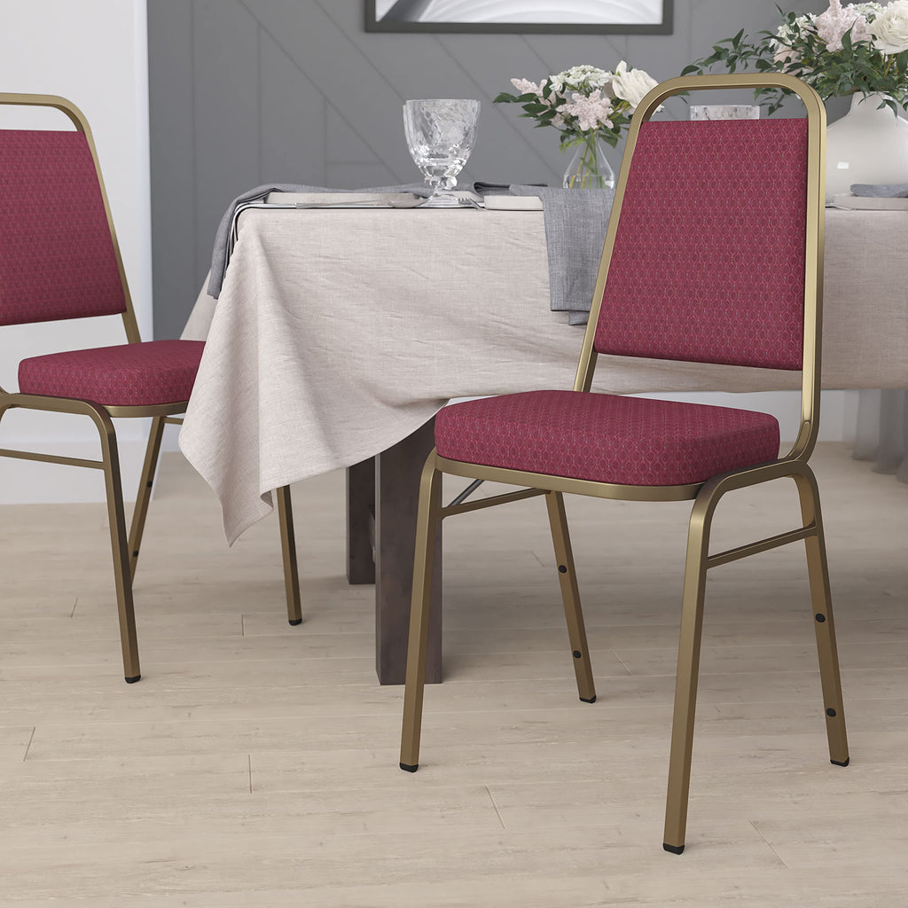 Emma + Oliver Burgundy Patterned Trapezoidal Back Stacking Banquet Chair, 17.5"W x 20.25"D x 36"H, Burgundy Patterned Fabric/gold Frame
